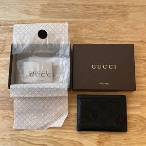Genuine Gucci ebony leather wallet